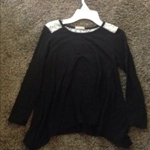 A black long sleeve shirt with lace